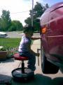 My niece putting my tires back on.